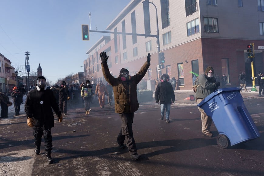 Demonstrators chant and walk towards law enforcement as they depart the site where a man identified as Alex Pretti was fatally shot by federal agents trying to detain him, in Minneapolis, Minnesota, U.S., January 24, 2026.REUTERS/Tim Evans