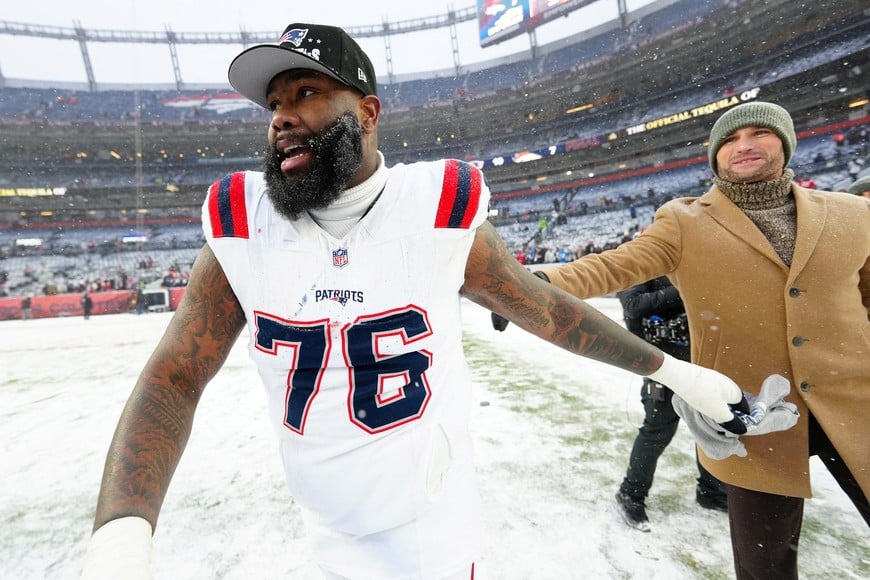Jan 25, 2026; Denver, CO, USA; New England Patriots offensive tackle Morgan Moses (76) reacts after defeating the Denver Broncos in the 2026 AFC Championship Game at Empower Field at Mile High. Mandatory Credit: Ron Chenoy-Imagn Images