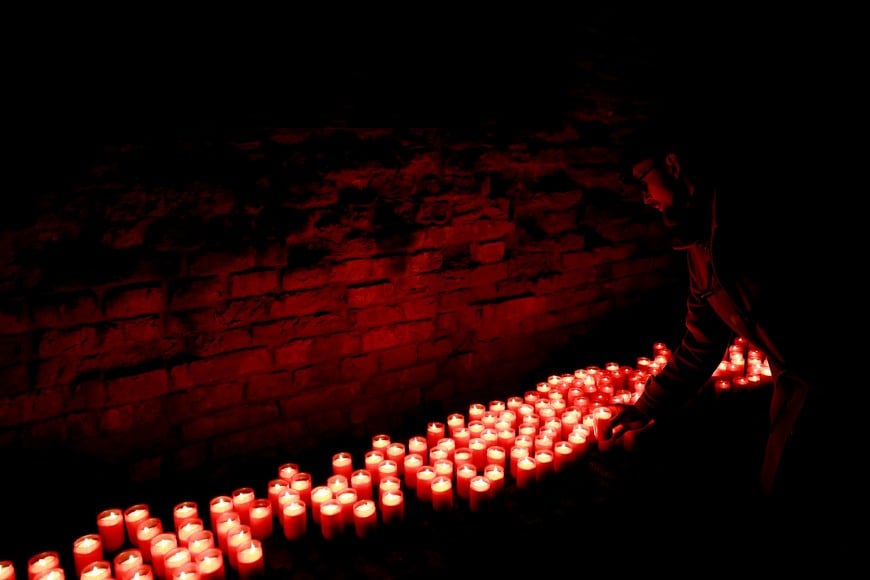 A person places a candle at the Jewish Cemetery in former Nazi concentration camp Terezin to mark the International Holocaust Remembrance Day in Terezin, Czech Republic, January 27, 2025. REUTERS/David W Cerny