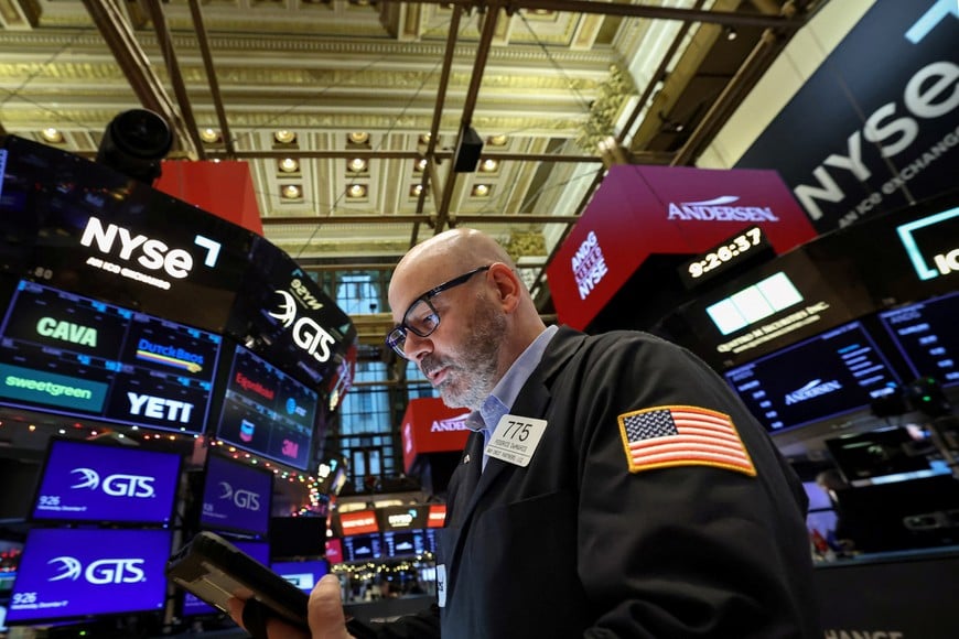 A trader works on the floor at the New York Stock Exchange (NYSE) in New York City, U.S., December 17, 2025. REUTERS/Brendan McDermid