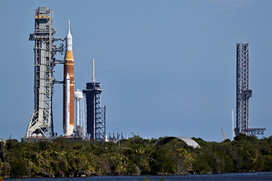 The Space Launch System (SLS) rocket, with the Orion crew capsule, rolls past SpaceX’s launch complex 39A toward launch complex 39B as preprations continue for the Artemis 2 mission to the Moon at Kennedy Space Center in Cape Canaveral, Florida, U.S., January 17, 2026. REUTERS/Steve Nesius