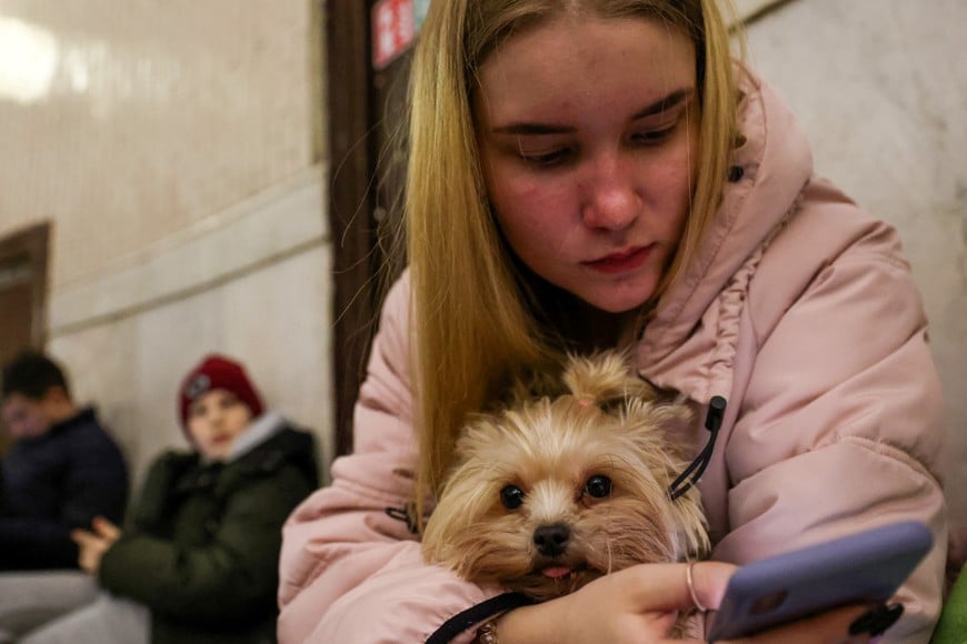 People gather at a metro station as they seek shelter from expected Russian air strikes in Kyiv, Ukraine, February 24, 2022. REUTERS/Umit Bektas