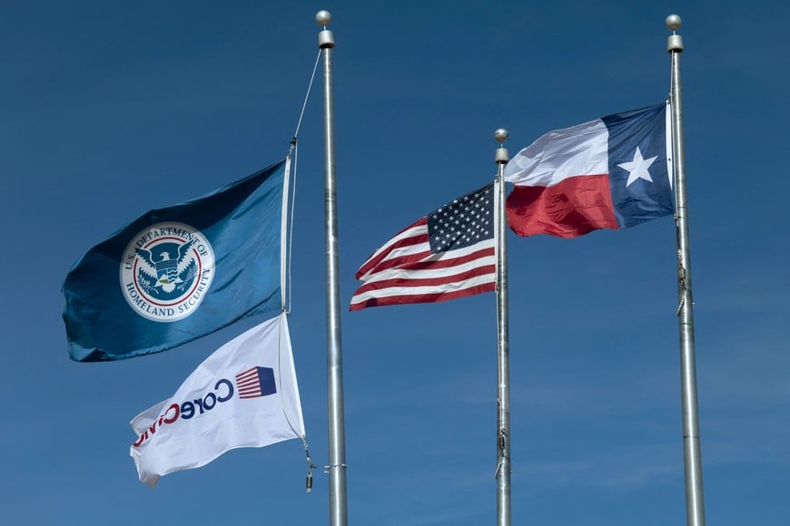 A Department of Homeland Security flag flies alongside the U.S. and Texas flags at the South Texas Family Residential Center  where Adrian Alexander Conejo Arias and his son, Liam Conejo Ramos, who were detained by federal agents from U.S. Immigration and Customs Enforcement (ICE), in Columbia Heights, Minnesota, are currently being held at the Dilley Immigration Processing Center in Dilley, Texas, U.S., January 22, 2026. REUTERS/Kaylee Greenlee