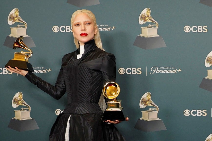Lady Gaga poses with the Best Dance Pop Recording award for "Abracadabra", and Best Pop Vocal Album award for "MAYHEM" during the 68th Annual Grammy Awards in Los Angeles, California, U.S., February 1, 2026. REUTERS/Mike Blake     TPX IMAGES OF THE DAY