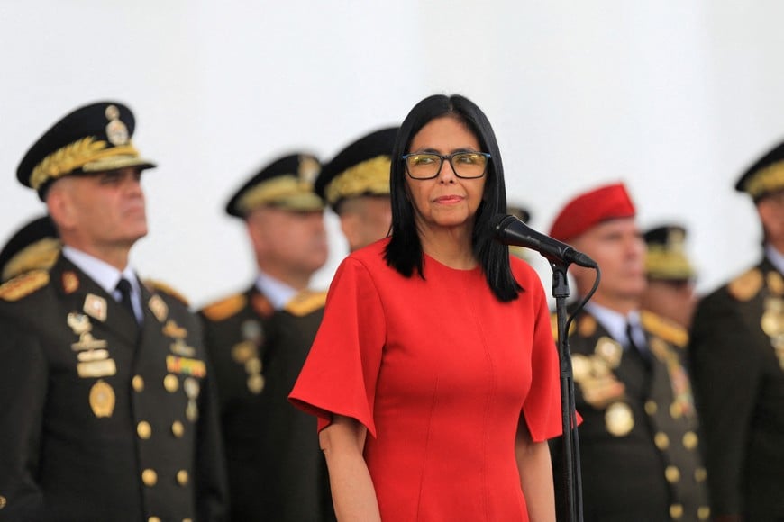 FILE PHOTO: Venezuela's interim President Delcy Rodriguez attends an event to receive the insignia of the commander-in-chief of the Armed Forces next to Venezuela's Defence Minister Vladimir Padrino Lopez, after assuming the presidency following the U.S. ouster of president Nicolas Maduro, at Fort Tiuna, in Caracas, Venezuela, January 28, 2026. Wendys Olivo/Miraflores Palace/Handout via REUTERS ATTENTION EDITORS - THIS IMAGE HAS BEEN SUPPLIED BY A THIRD PARTY/File Photo