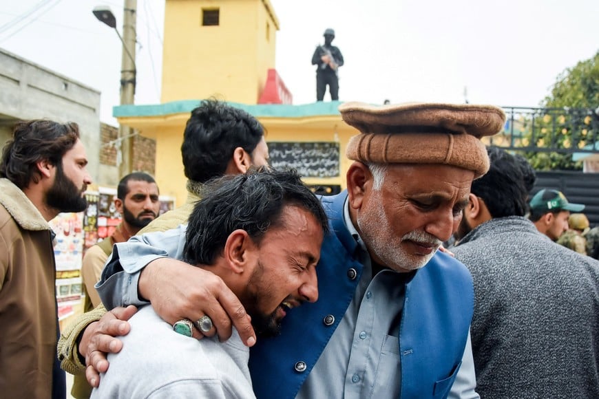 A man reacts while being comforted, after a deadly explosion at a Shi'ite Muslim mosque in Islamabad, Pakistan, February 6, 2026. REUTERS/Waseem Khan