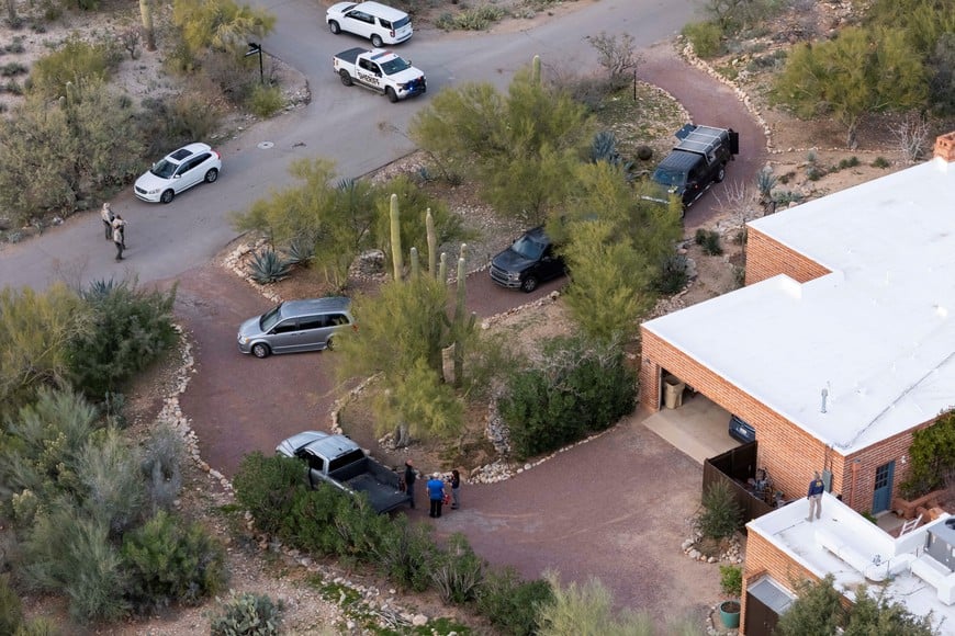 A drone view shows investigators searching the home of Nancy Guthrie, the 84-year-old mother of U.S. journalist and television host Savannah Guthrie, who went missing from her home in Tucson, U.S. February 6, 2026.  REUTERS/Rebecca Noble