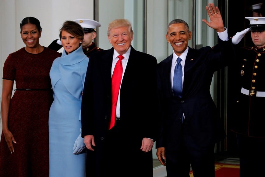 FILE PHOTO: U.S. President Barack Obama (R) and first lady Michelle Obama (L) greet U.S. President-elect Donald Trump and his wife Melania for tea before the inauguration at the White House in Washington, U.S. January 20, 2017. REUTERS/Jonathan Ernst/File Photo