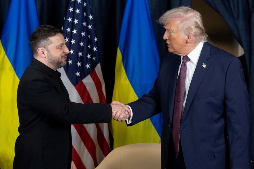 Ukraine's President Volodymyr Zelenskiy and U.S. President Donald Trump shake hands during their meeting at the sidelines of the 56th annual World Economic Forum (WEF), in Davos, Switzerland, January 22, 2026. Ukrainian Presidential Press Service/Handout via REUTERS ATTENTION EDITORS - THIS IMAGE HAS BEEN SUPPLIED BY A THIRD PARTY.