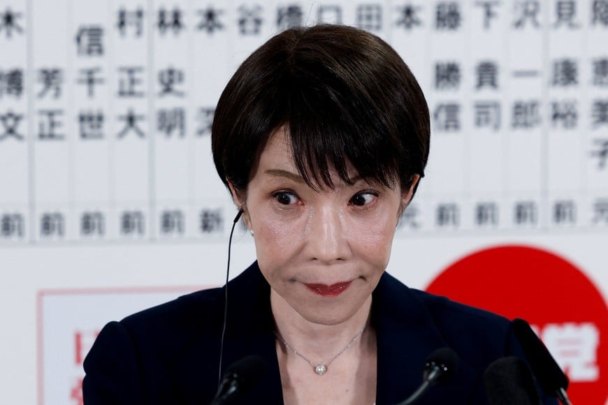 Japan's Prime Minister Sanae Takaichi, leader of the ruling Liberal Democratic Party (LDP), reacts as she speaks to the media in front of a board displaying the names of LDP candidates at the LDP headquarters on general election day in Tokyo, Japan, February 8, 2026. REUTERS/Kim Kyung-Hoon/Pool