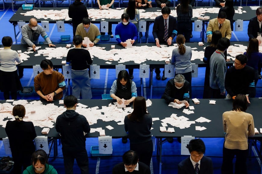 Election officials work at a ballot counting centre, on the day of the country's general election, in Tokyo, Japan, February 8, 2026. REUTERS/Manami Yamada