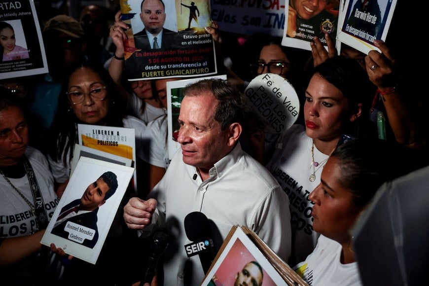 Venezuelan opposition politician Juan Pablo Guanipa speaks to the media outside the Helicoide detention center during a visit to the relatives of political prisoners, after he was released from the Bolivarian National Police (PNB) Mariperez detention center, as rights group Foro Penal says some political prisoners were freed on Sunday and it is checking more cases, in Caracas, Venezuela, February 8, 2026. REUTERS/Leonardo Fernandez Viloria