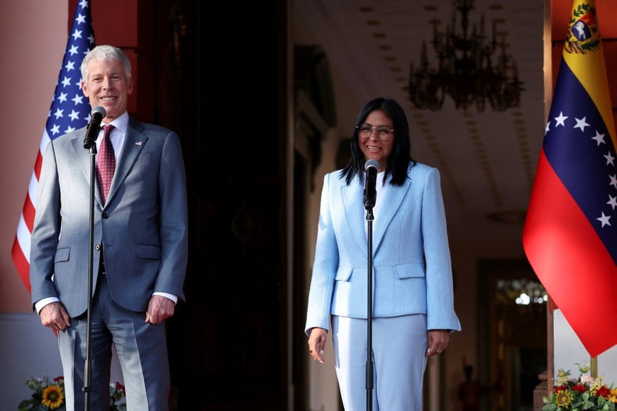 Venezuela's interim President Delcy Rodriguez and U.S. Energy Secretary Chris Wright speak with the media after attending a meeting, marking the highest-level U.S. visit focused on energy policy to the OPEC nation in nearly three decades, as Washington conducts its first on-the-ground assessment of the oil industry it aims to help rebuild, in Caracas, Venezuela, February 11, 2026. REUTERS/Leonardo Fernandez Viloria