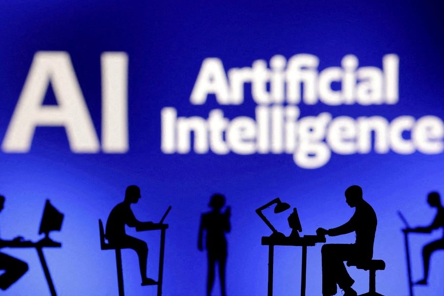 FILE PHOTO: Figurines with computers and smartphones are seen in front of the words "Artificial Intelligence AI" in this illustration taken, February 19, 2024. REUTERS/Dado Ruvic/Illustration/File Photo