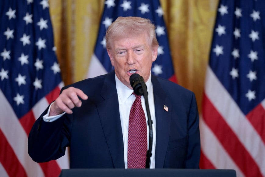 FILE PHOTO: U.S. President Donald Trump speaks as he hosts an event promoting coal-powered energy sources, in the East Room at the White House in Washington, D.C., U.S. February 11, 2026. REUTERS/Jonathan Ernst/File Photo