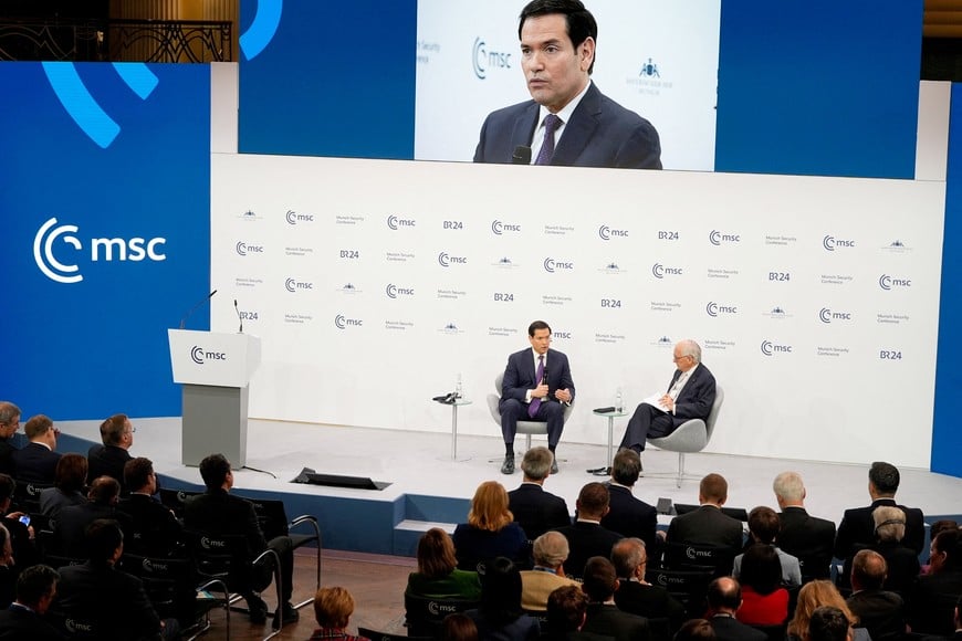 U.S. Secretary of State Marco Rubio speaks, next to the Chairman of the Munich Security Conference Wolfgang Ischinger, at the Munich Security Conference in Munich, Germany, February 14, 2026.     Alex Brandon/Pool via REUTERS