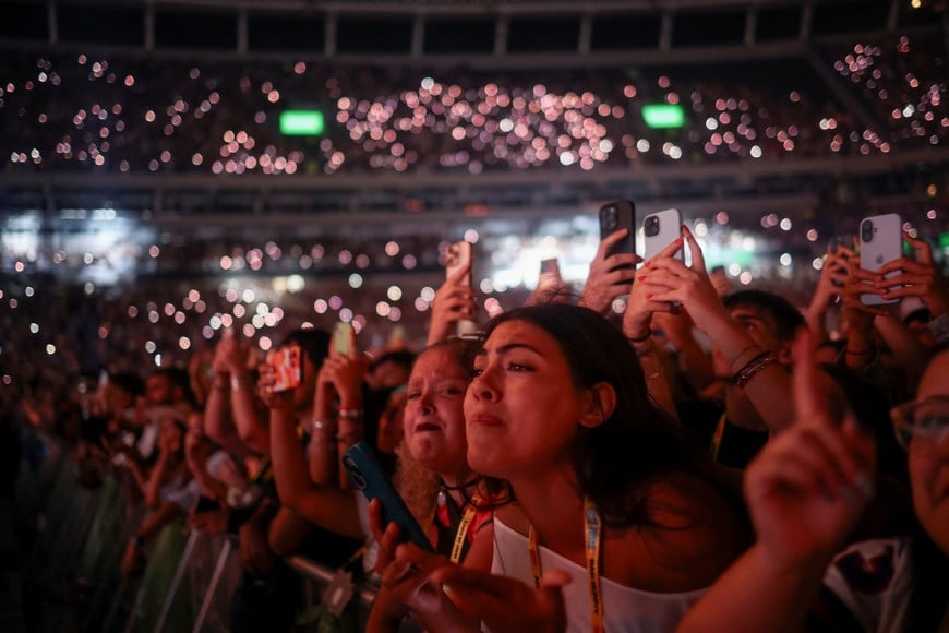 People react as Puerto Rican singer Bad Bunny performs at his "DeBI TiRAR MaS FOToS World Tour" concert in Buenos Aires, Argentina, February 13, 2026. REUTERS/Tomas Cuesta