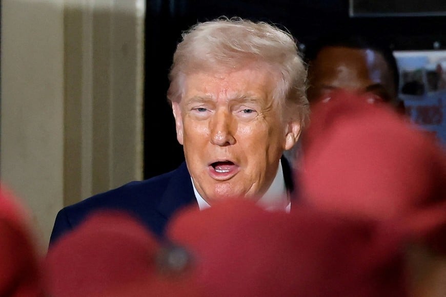FILE PHOTO: U.S. President Donald Trump reacts during a visit at Fort Bragg, North Carolina, U.S., February 13, 2026. REUTERS/Jonathan Drake/File Photo
