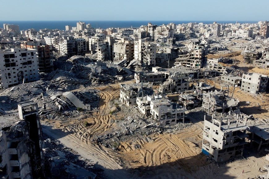 FILE PHOTO: A drone view shows the destruction in a residential neighborhood, after the withdrawal of the Israeli forces from the area, amid a ceasefire between Israel and Hamas in Gaza, in Gaza City, October 21, 2025. REUTERS/Dawoud Abu Alkas/File Photo