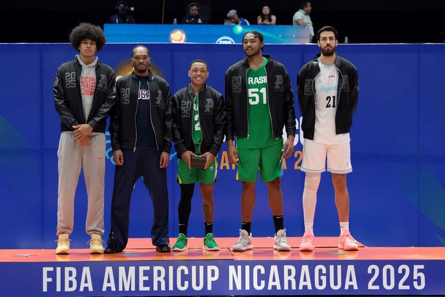 Basketball - FIBA AmeriCup 2025 - Final - Argentina v Brazil - Polideportivo Alexis Arguello, Managua, Nicaragua - August 31, 2025
Most valuable players Canada's Kyshawn George, Javonte Smart of the U.S., Brazil's Yago Santos, Brazil's Bruno Caboclo, and Argentina's Juan Fernandez celebrate on the podium after the FIBA AmeriCup 2025 REUTERS/Luisa Gonzalez