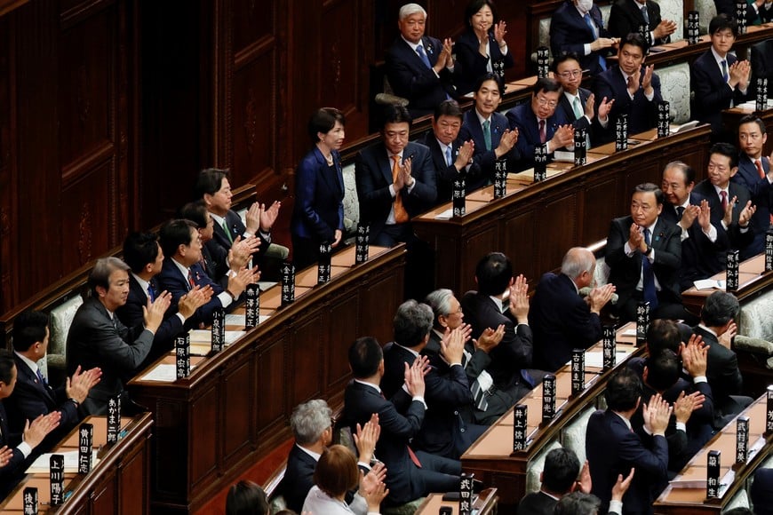 Japanese Prime Minister Sanae Takaichi reacts as she receives applause after being reelected as prime minister, at the lower house of parliament in Tokyo, Japan February 18, 2026. REUTERS/Kim Kyung-Hoon
