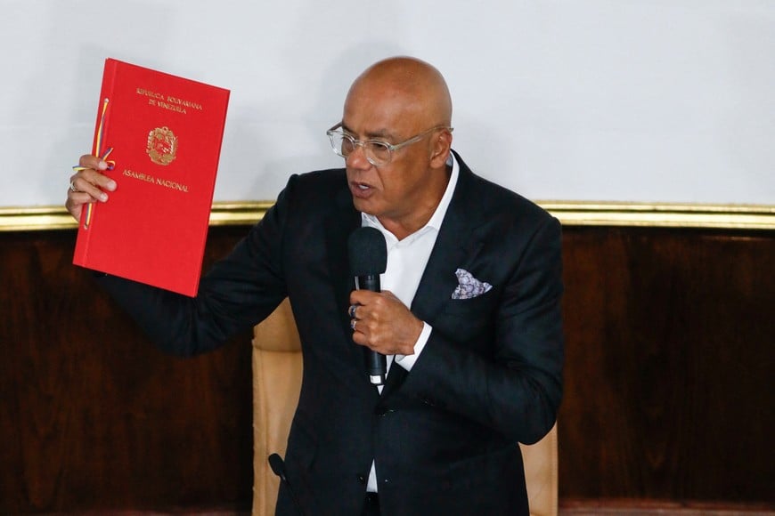 Venezuela's National Assembly President Jorge Rodriguez holds the document of an amnesty law meant to grant immediate clemency to individuals jailed for participating in political protests, after its approval, in Caracas, Venezuela February 19, 2026. REUTERS/Fausto Torrealba     TPX IMAGES OF THE DAY