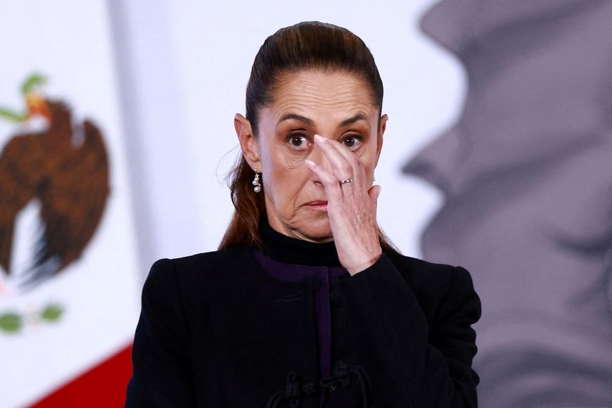 Mexico's President Claudia Sheinbaum reacts during a press conference about the wave of violence in Mexico, following the killing of Mexican drug lord Nemesio Oseguera, known as 'El Mencho', in a military operation on Sunday, at Palacio Nacional, in Mexico City, Mexico, February 23, 2026. REUTERS/Raquel Cunha
TPX IMAGES OF THE DAY