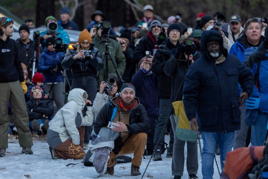 People look at the Horsetail Fall near El Capitan in Yosemite National Park, California, U.S., February 15, 2023. The phenomenon of this vista only occurs for only few days in February each year when several weather and climatic conditions are just right. REUTERS/Carlos Barria