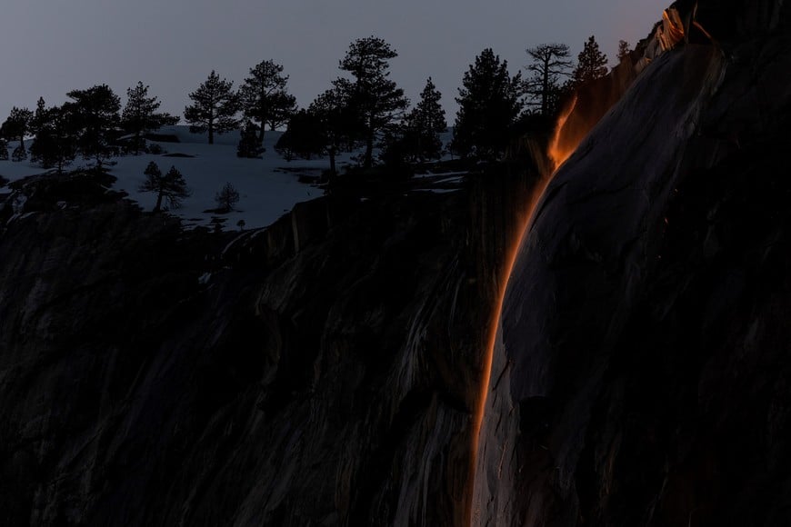 Horsetail Fall at El Capitan is seen during sunset in Yosemite National Park, California, U.S., February 15, 2023. The phenomenon of this vista only occurs for only few days in February each year when several weather and climatic conditions are just right. REUTERS/Carlos Barria