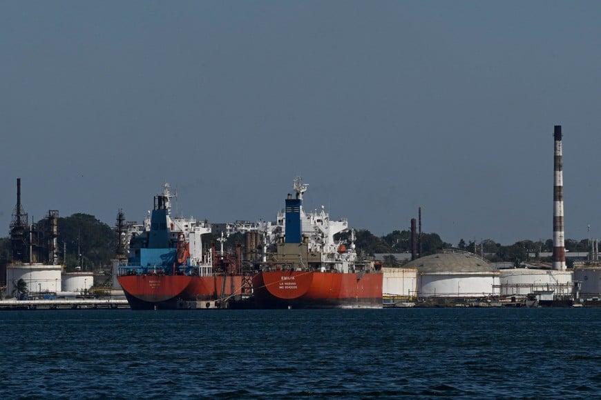 Ships are docked at the pier of the Nico Lopez oil refinery in Havana Bay, as the U.S. Treasury Department said it would authorize companies seeking licenses to resell Venezuelan oil to Cuba, in Havana, Cuba February 25, 2026. REUTERS/Norlys Perez