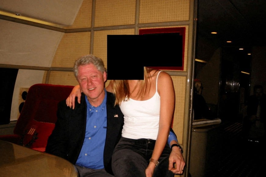 Former U.S. President Bill Clinton and a woman are seen in this image from the estate of late financier and convicted sex offender Jeffrey Epstein, released by the Department of Justice in Washington, D.C., U.S., on December 19, 2025. U.S. Justice Department/Handout via REUTERS   THIS IMAGE HAS BEEN SUPPLIED BY A THIRD PARTY REDACTED AREAS FROM SOURCE.     TPX IMAGES OF THE DAY       THIS PICTURE WAS PROCESSED BY REUTERS TO ENHANCE QUALITY. AN UNPROCESSED VERSION HAS BEEN PROVIDED SEPARATELY.