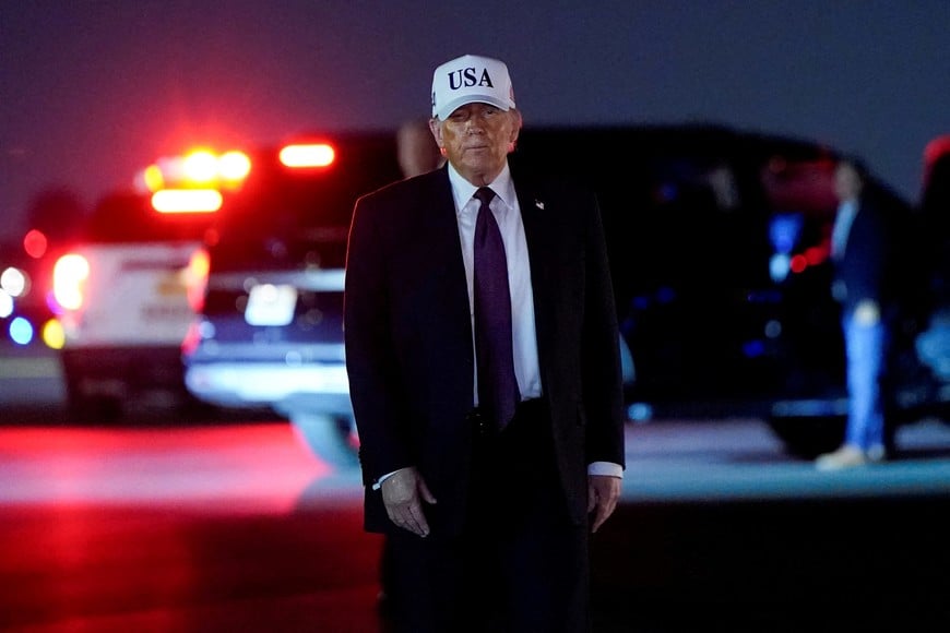 U.S. President Donald Trump looks on after disembarking Air Force One at Palm Beach International Airport in West Palm Beach, Florida, U.S., February 27, 2026. REUTERS/Elizabeth Frantz     TPX IMAGES OF THE DAY