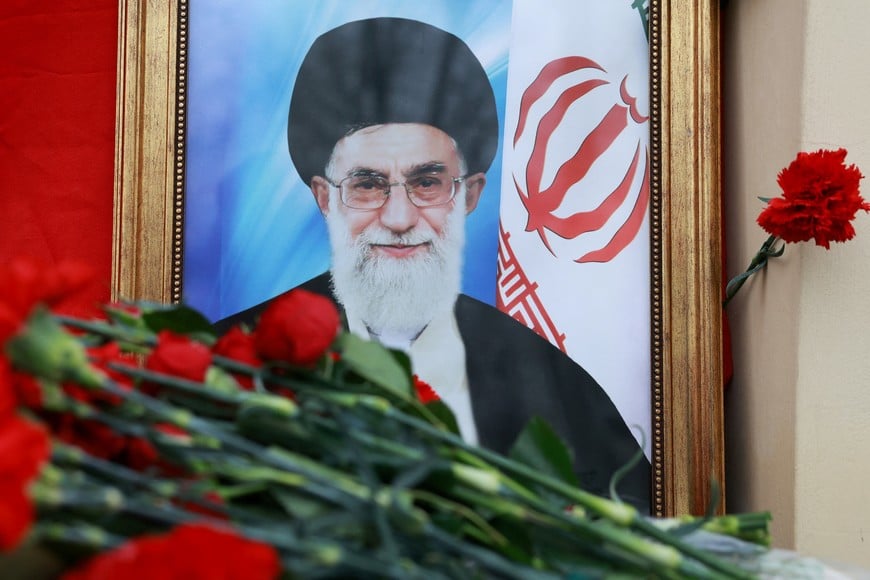 A portrait of Iran's late Supreme Leader Ayatollah Ali Khamenei, who was killed in Israeli and U.S. strikes on Saturday, stands among flowers outside the Iranian Embassy in Moscow, Russia March 2, 2026. REUTERS/Ramil Sitdikov