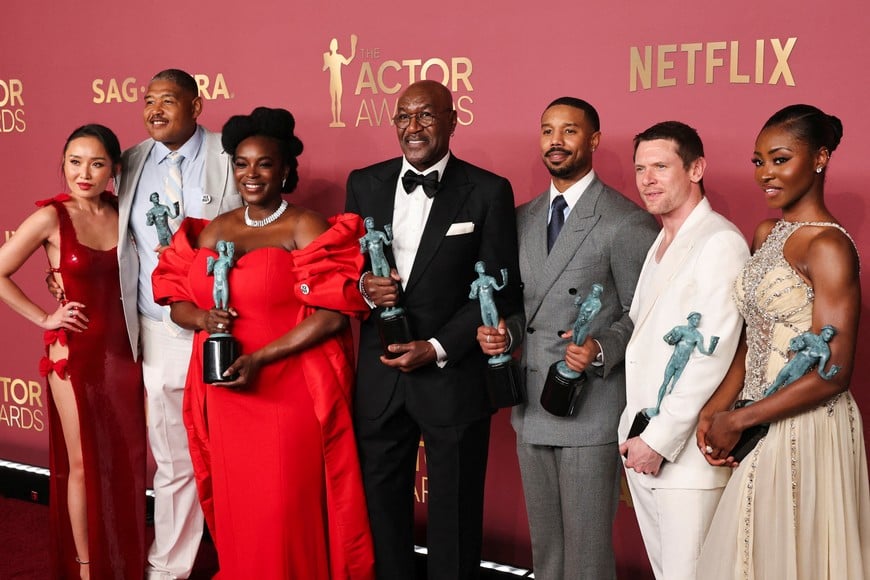 Li Jun Li, Omar Benson Miller, Wunmi Mosaku, Delroy Lindo, Michael B. Jordan, Jack O'Connell, Jayme Lawson pose with the Outstanding Performance By A Cast In A Motion Picture award for "Sinners" during the Actor Awards, in Los Angeles, California, U.S., March 1, 2026. REUTERS/Daniel Cole     TPX IMAGES OF THE DAY