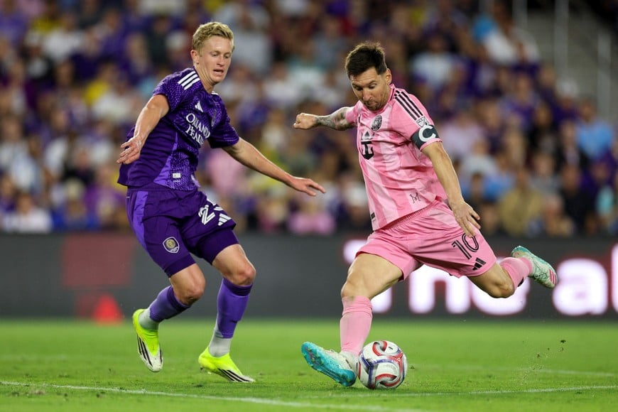 Mar 1, 2026; Orlando, Florida, USA; Inter Miami CF forward Lionel Messi (10) scores a goal past Orlando City SC midfielder Colin Guske (25) in the second half at Inter&Co Stadium. Mandatory Credit: Nathan Ray Seebeck-Imagn Images
