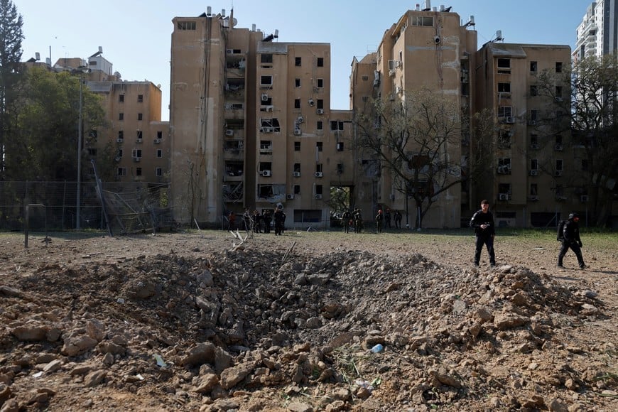 Emergency responders attend the scene of an Iranian missile strike, amid the U.S.-Israeli conflict with Iran, in Beersheba, southern Israel, March 2, 2026. REUTERS/Amir Cohen
