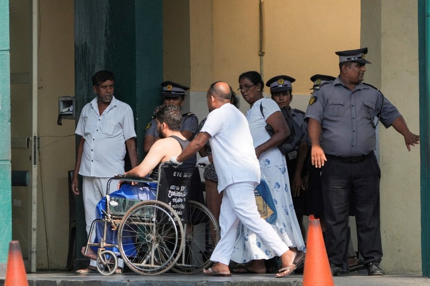 An injured person moves on a wheelchair at the National Hospital Galle where he will receive treatment after a submarine attack on an Iranian ship off Sri Lanka, in Galle, Sri Lanka, March 4, 2026. REUTERS/Thilina Kaluthotage     TPX IMAGES OF THE DAY