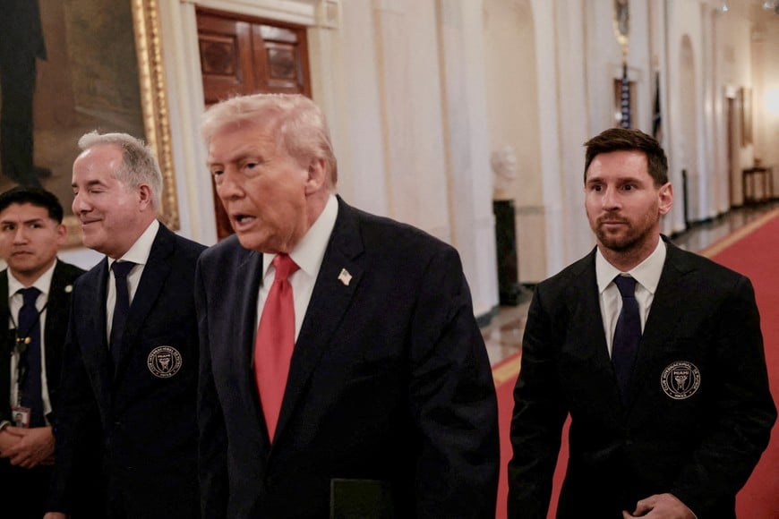 U.S. President Donald Trump arrives next to Inter Miami CF captain Lionel Messi, on the day he honors reigning Major League Soccer (MLS) champion Inter Miami CF players and team officials with an event in the East Room of the White House in Washington, D.C., U.S., March 5, 2026. REUTERS/Jonathan Ernst REFILE - QUALITY REPEAT