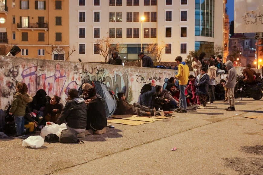 People, displaced from the southern suburbs of Beirut after the Israeli army's warning prompted residents to evacuate following an escalation between Hezbollah and Israel amid the U.S.-Israeli conflict with Iran, gather at Martyrs' Square in Beirut, Lebanon, March 5, 2026. REUTERS/Khalil Ashawi