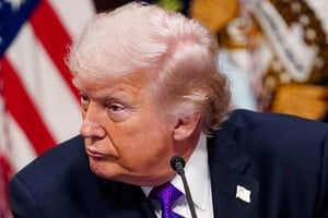 FILE PHOTO: U.S. President Donald Trump attends a roundtable on the Ratepayer Protection Pledge in the Indian Treaty Room in the Eisenhower Executive Office Building (EEOB) on the White House campus in Washington, D.C., U.S., March 4, 2026. REUTERS/Nathan Howard/File Photo