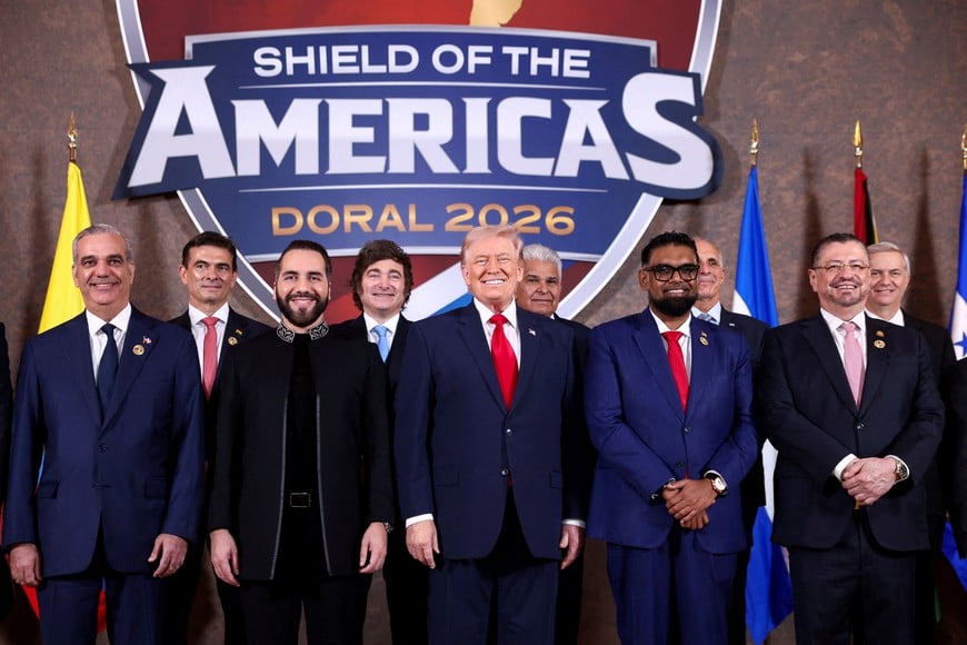 U.S. President Donald Trump, Dominican Republic President Luis Abinader, Argentina's President Javier Milei, El Salvador's President Nayib Bukele, Guyana's President Mohamed Irfaan Ali, Costa Rica's President Rodrigo Chaves Robles, Bolivia's President Rodrigo Paz and Chile's President-elect Jose Antonio Kast pose for a family photo during the "Shield of the Americas" Summit in Miami, Florida, U.S., March 7, 2026. REUTERS/Kevin Lamarque REFILE - ADDING IDs