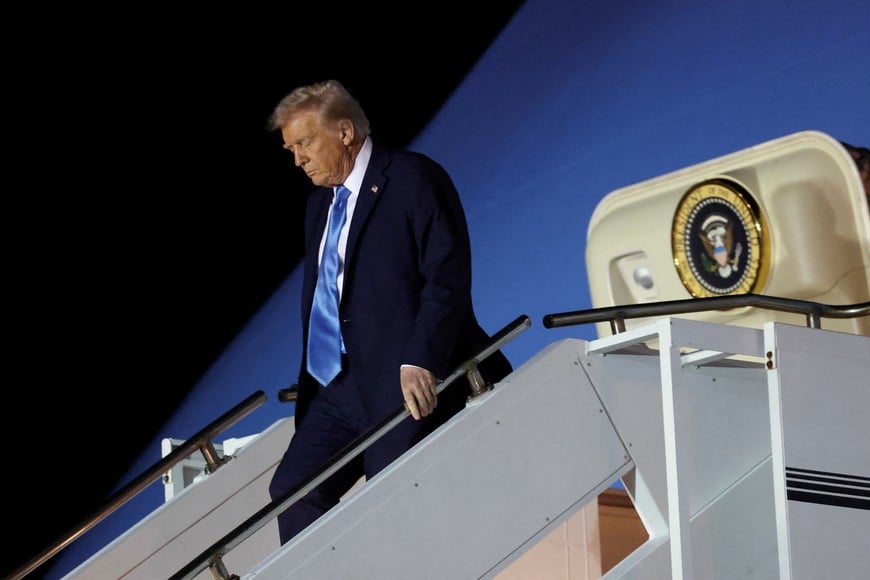 FILE PHOTO: U.S. President Donald Trump steps down from Air Force One upon his arrival in West Palm Beach, Florida, U.S., January 31, 2025. REUTERS/Kevin Lamarque/File Photo