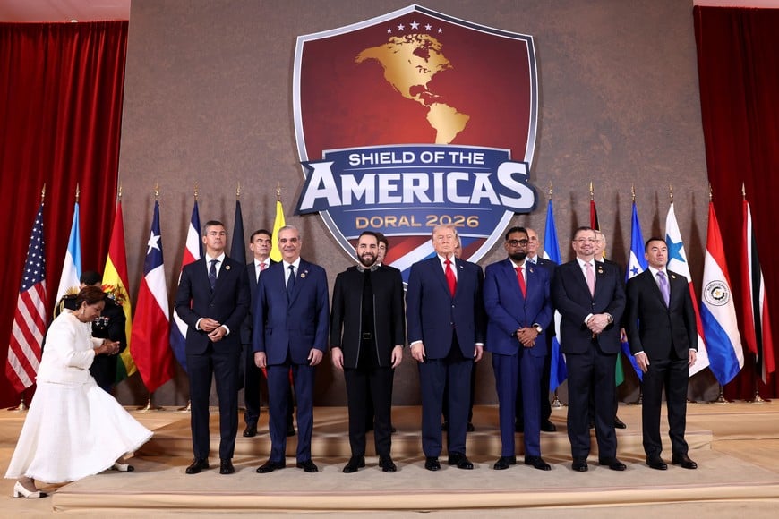 U.S. President Donald Trump, Dominican Republic President Luis Abinader, Argentina's President Javier Milei, El Salvador's President Nayib Bukele, Guyana's President Mohamed Irfaan Ali, Costa Rica's President Rodrigo Chaves Robles, Bolivia's President Rodrigo Paz, Ecuador's President Daniel Noboa, Paraguay's President Santiago Pena and Chile's President-elect Jose Antonio Kast pose for a family photo during the "Shield of the Americas" Summit in Miami, Florida, U.S., March 7, 2026. REUTERS/Kevin Lamarque