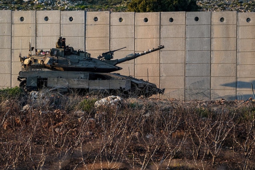 Israeli soldiers sit astride a tank, following an escalation between Hezbollah and Israel, amid the U.S.-Israeli conflict with Iran, near the Israel-Lebanon border in northern Israel, March 7, 2026. REUTERS/Ayal Margolin    ISRAEL OUT. NO COMMERCIAL OR EDITORIAL SALES IN ISRAEL