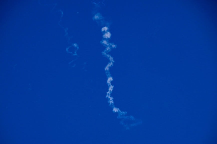 Vapor trails in the sky after Israel intercepted missiles launched from Iran, amid the U.S.-Israeli conflict with Iran, as seen from Tel Aviv, Israel, March 8, 2026. REUTERS/Dylan Martinez
