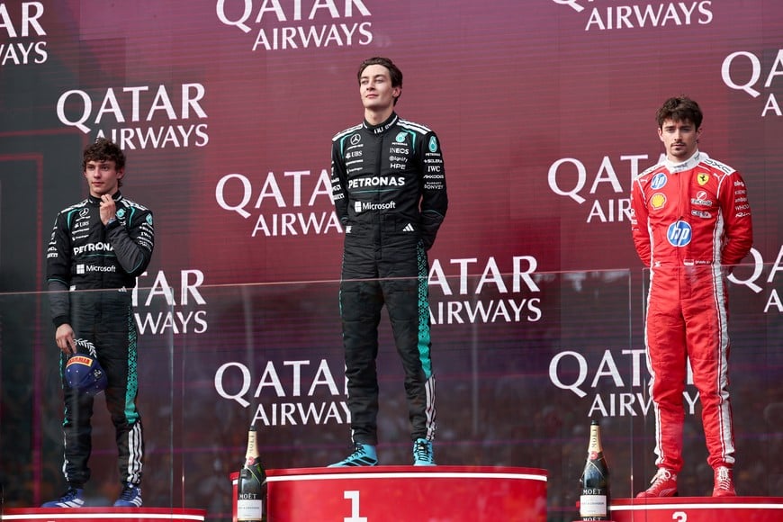 Formula One F1 - Australian Grand Prix - Albert Park Grand Prix Circuit, Melbourne, Australia - March 8, 2026
Mercedes' George Russell celebrates on the podium after winning the Australian Grand Prix alongside second placed Mercedes' Andrea Kimi Antonelli and third placed Ferrari's Charles Leclerc REUTERS/Mark Peterson
