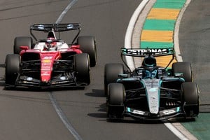 Formula One F1 - Australian Grand Prix - Albert Park Grand Prix Circuit, Melbourne, Australia - March 8, 2026
Ferrari's Charles Leclerc and Mercedes' George Russell in action during the race REUTERS/Mark Peterson