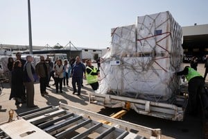 Workers unload aid supplies as the first aid shipment from the European Union and UNICEF arrives at Beirut-Rafic Hariri International Airport, following an escalation between Hezbollah and Israel amid the U.S.-Israeli conflict with Iran, in Beirut, Lebanon, March 10, 2026. REUTERS/Khalil Ashawi
