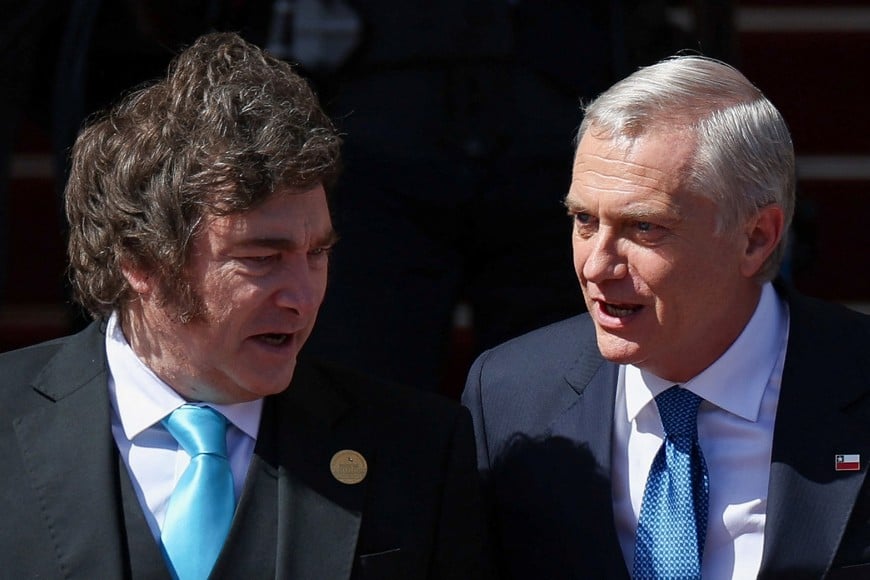 Argentina's President Javier Milei talks to Chile's President-elect Jose Antonio Kast as he arrives at Chile's Congress on the day of Kast's swearing-in ceremony, in Valparaiso, Chile March 11, 2026. REUTERS/Pablo Sanhueza