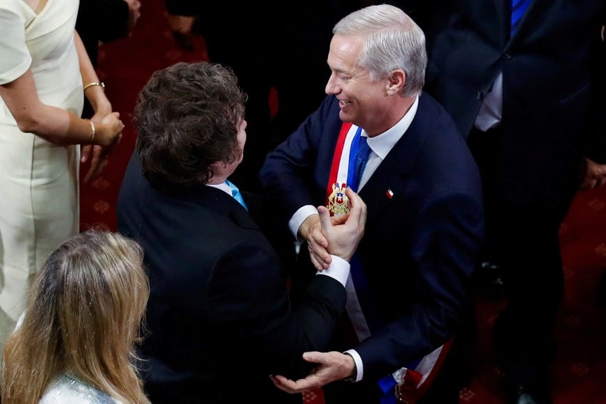 Argentina's President Javier Milei congratulates Chile's President Jose Antonio Kast, wearing the presidential sash,  during Kast's swearing-in ceremony, at the Congress, in Valparaiso, Chile, March 11, 2026. REUTERS/Rodrigo Garrido